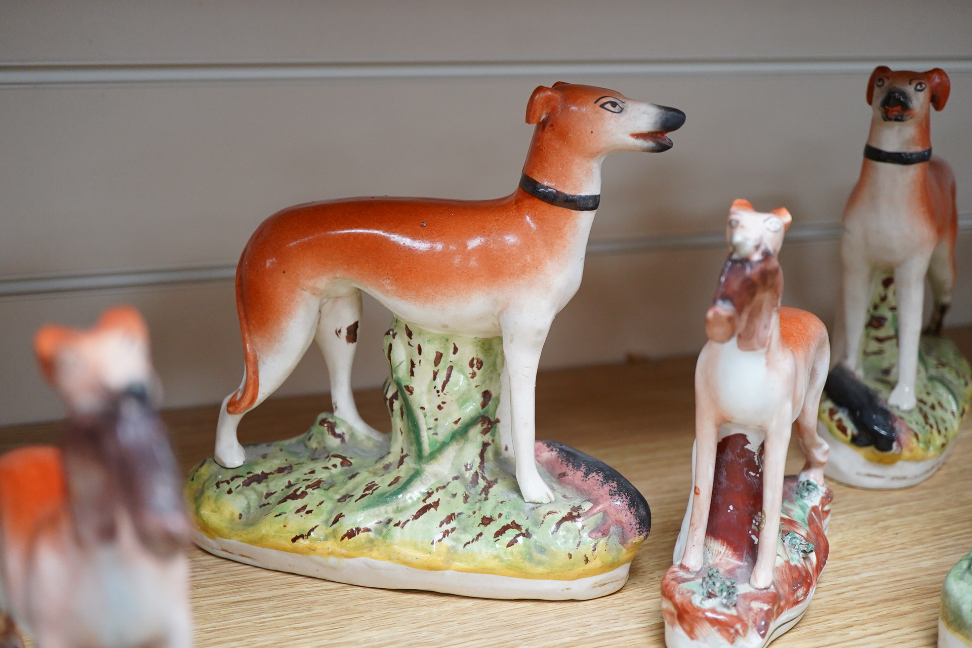 Two pairs of Victorian Staffordshire zebra models and others to include three sheep spill vases, largest 19cm high